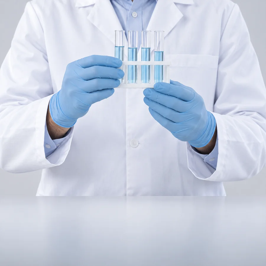 Gloved hands reviewing laboratory samples